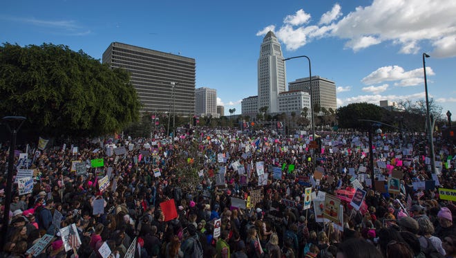 People fill the streets near the Los Angeles City Hall, at right, during the Women's March.