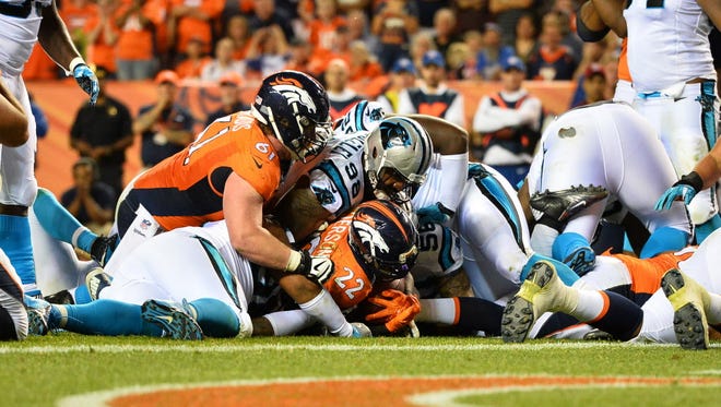 Denver Broncos running back C.J. Anderson (22) carries to the 1-yard line in the fourth quarter against the Carolina Panthers.