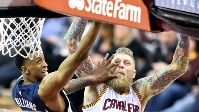 Dec 13, 2016; Cleveland, OH, USA; Memphis Grizzlies forward Troy Williams (10) drives to the basket against Cleveland Cavaliers forward Chris Andersen (00) in the fourth quarter at Quicken Loans Arena. Mandatory Credit: David Richard-USA TODAY Sports