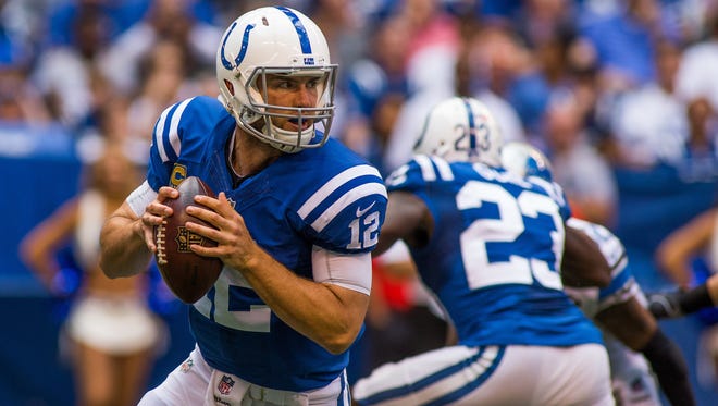 Indianapolis Colts quarterback Andrew Luck (12) looks to pass the ball in the first quarter of the game against the Detroit Lions at Lucas Oil Stadium.