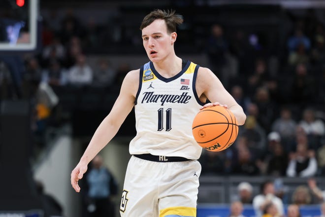 Mar 24, 2024; Indianapolis, IN, USA; Marquette Golden Eagles guard Tyler Kolek (11) dribbles against the Colorado Buffaloes during the first half at Gainbridge FieldHouse. Mandatory Credit: Trevor Ruszkowski-USA TODAY Sports