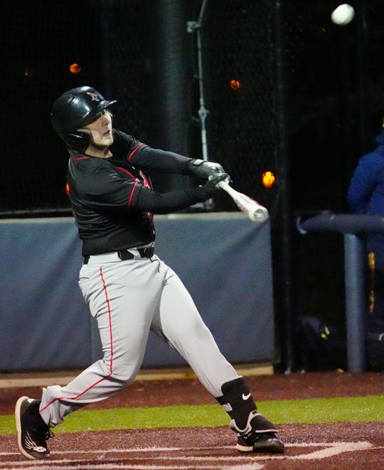 Waukesha South's Brandon Dable (2) connects for a single during the game against Pius XI at Frame Park in Waukesha, Thursday, March 28, 2024.