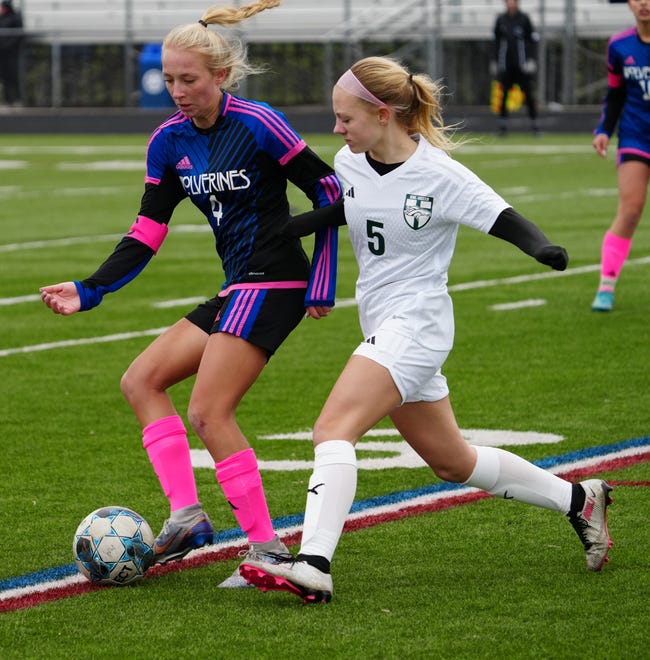 Waukesha West's Megan Thomsen (4) battles Kettle Moraine Lutheran's Lauryn Haines (5) during the match at Waukesha West on Saturday, March 30, 2024.