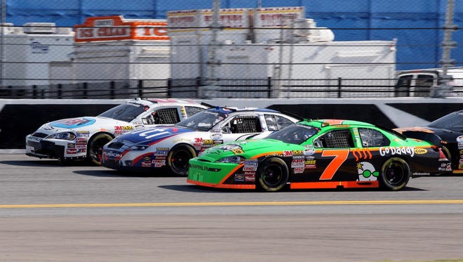 Danica Patrick (7) battles Ricky Stenhouse Jr. (6) and Mike Wallace (01) for position on the backstretch during the Drive4COPD 300 at Daytona International Speedway in 2010.