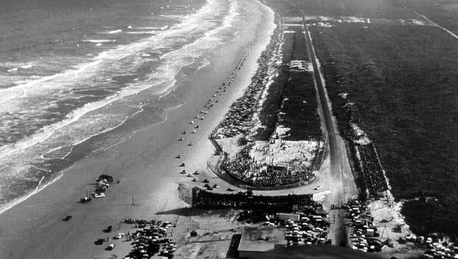 Pre-Daytona 500: An aerial view of the North Turn and grandstand as cars race on the Daytona Beach Road Course in 1950.