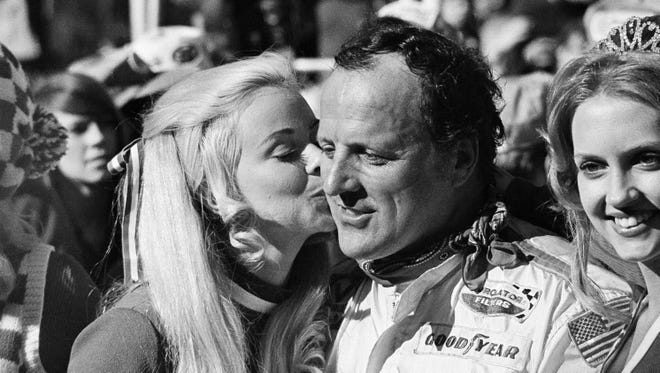 A.J. Foyt gets a big kiss from Union 76 Racestopper Cheryl Johnson after winning the 1972 Daytona 500. Foyt is the only driver to win the Indianapolis 500 (which he won four times), the Daytona 500, the 24 Hours of Daytona, and the 24 Hours of Le Mans.
