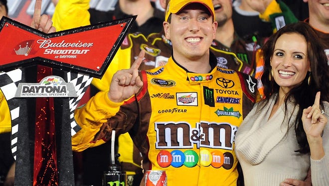 Kyle Busch poses with wife, Samantha, on February 18, 2012 after winning the Budweiser Shootout at Daytona