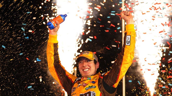 ORG XMIT: USPW-26252 Jul 09, 2011; Sparta, KY, USA; NASCAR Sprint Cup Series driver Kyle Busch (18) celebrates winning the Quaker State 400 at Kentucky Speedway. Mandatory Credit: Kevin Liles-US PRESSWIRE ORIG FILE ID:  20110709_kdl_al3_009.JPG