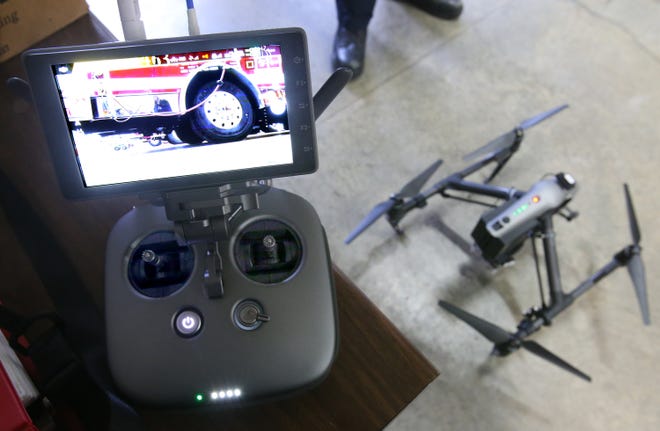 The Merton Fire Department drone controller with real-time high-definition video from one of the drone's two cameras. A second operator monitors tablet receiving imaging from the drone's infrared camera.
