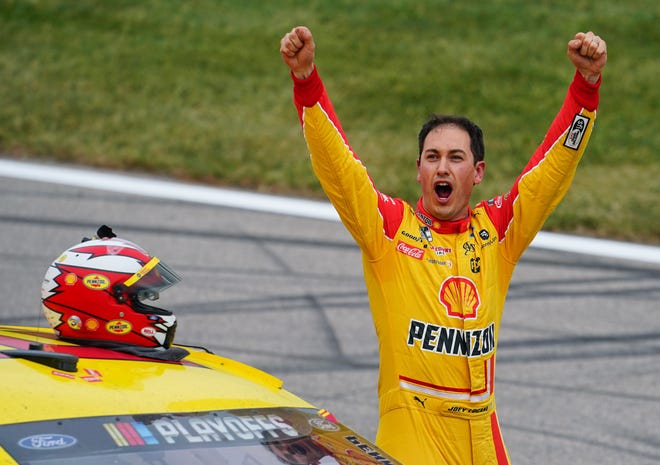 Joey Logano celebrates after winning the playoff race at Kansas Speedway on Oct 18, 2020. The win clinched another berth in the Championshp 4 for the 2018 Cup Series champion.