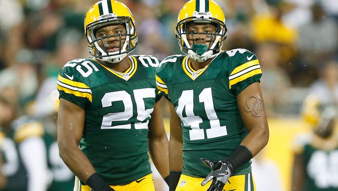 Packers defensive back Marwin Evans (left) and cornerback Randall Jette stand next to each other during a preseason game against the Cleveland Browns.