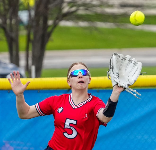 Brookfield East center fielder Amy Ehlinger (5) pulls in a fly ball during the game at Germantown, Tuesday, April 23, 2024.