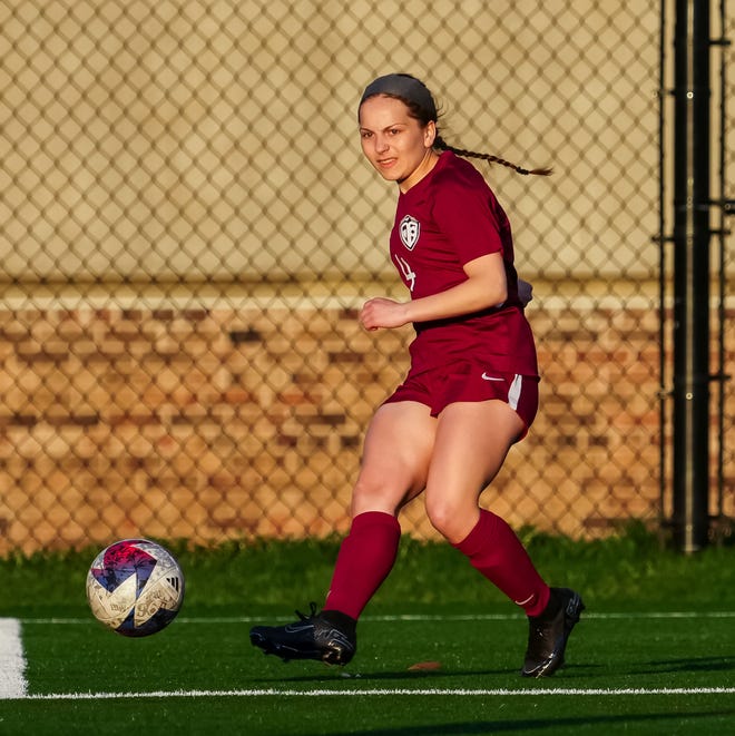 Menomonee Falls' Sydney Lynch (4) sends the ball downfield during the match at home against Germantown, Tuesday, April 23, 2024.