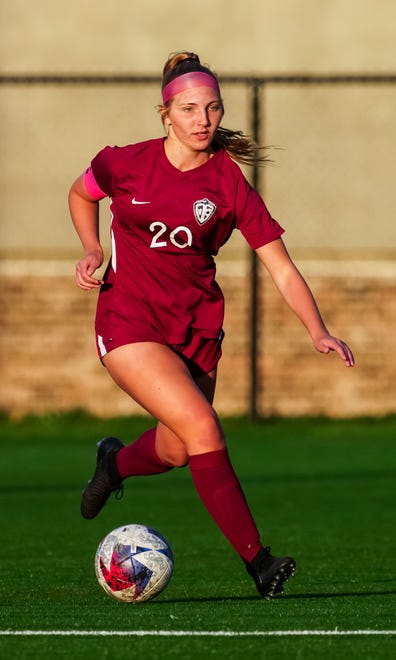 Menomonee Falls' Sydney Bandt (20) races downfield during the match at home against Germantown, Tuesday, April 23, 2024.