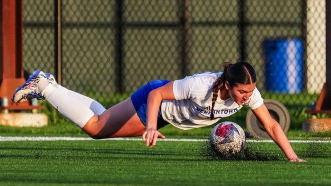 Germantown's Mila Schroeder (10) takes a fall during the match at Menomonee Falls, Tuesday, April 23, 2024. Germantown won 4-2.
